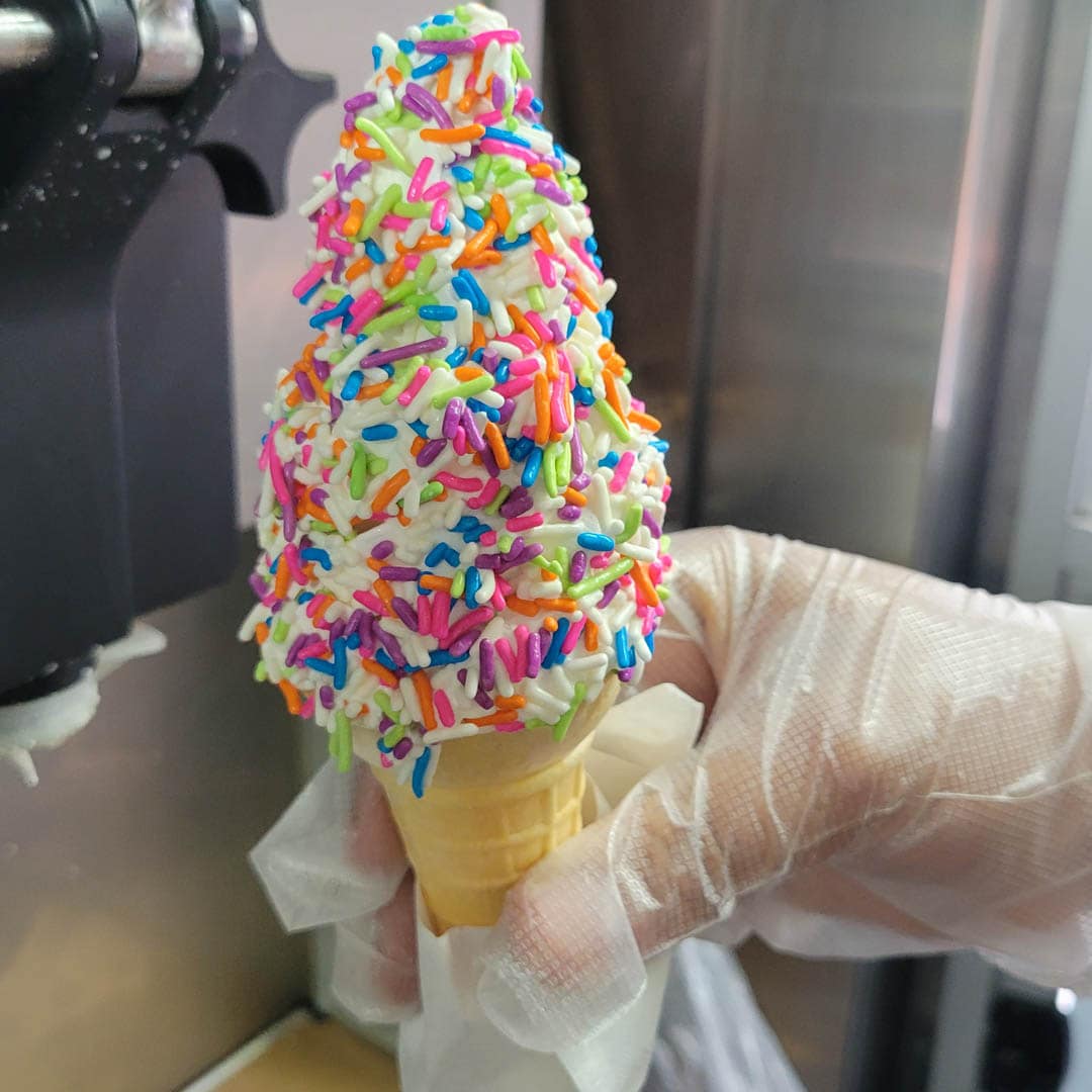 rainbow sprinkles soft ice cream cone Rainbow sprinkles soft ice cream cone